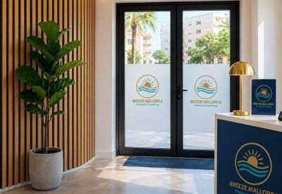 Reception entrance at Calle Cala Blanca 1, Palmanova featuring a branded front desk and glass doors.