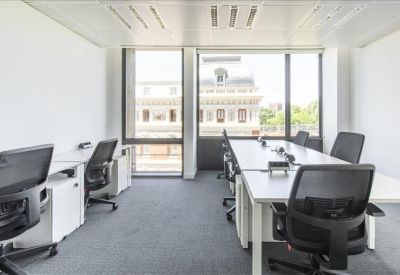 Internal office suite with shared desks and natural light.