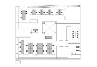 Floor plan schematic showing the layout of desks, meeting rooms, and common areas.