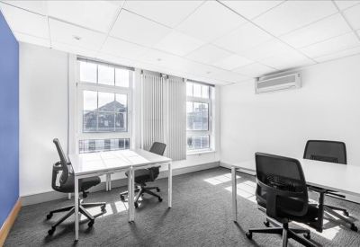 Modern white kitchenette with a coffee machine and minimalist shelving.
