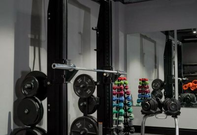 Game room with a professional foosball table and pool table under warm lighting.