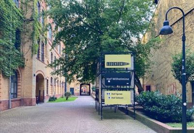 Private office suite with a white desk and arched window view.