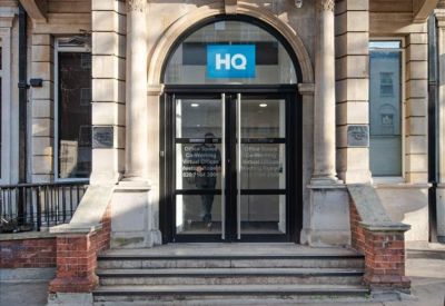 Classic stone-facade entrance of 344-354 Gray’s Inn Road with arched glass doors.