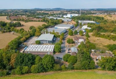Aerial view of the industrial units and surrounding greenery at Hartlebury Trading Estate.