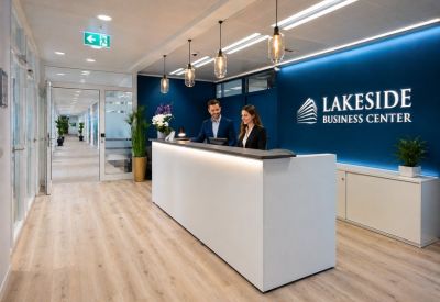 Modern reception desk with blue feature wall and staff.