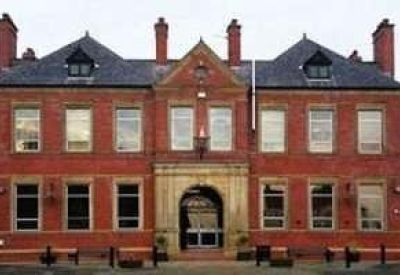 Symmetrical red brick exterior of the building at Lower Warrengate, Wakefield, Yorkshire, United Kingdom.