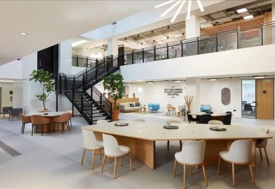 Spacious communal area with dining tables and lounge seating.