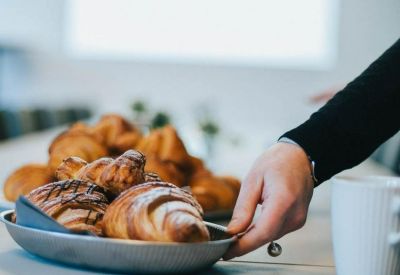 Close-up of fresh croissants on a table during a coffee break.