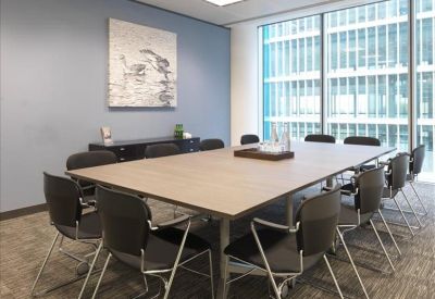 Modern boardroom featuring a long meeting table and blue feature wall, One Kingdom Street, London, W2.