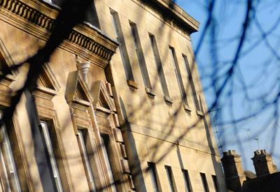 Close-up architectural detail of the stone facade of Orion House, 14 Barn Hill.