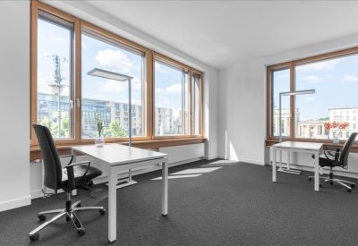 Spacious two-person office suite with large windows and city views.