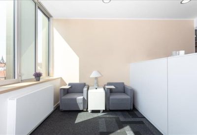Sleek minimalist reception desk under warm pendant lighting.