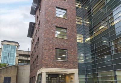 Exterior view of the brick and glass facade at Rotterdam House.