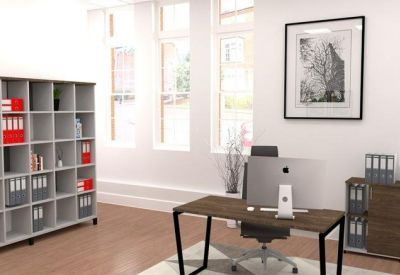 Private office featuring a large grey storage unit, a wooden desk, and framed wall art.