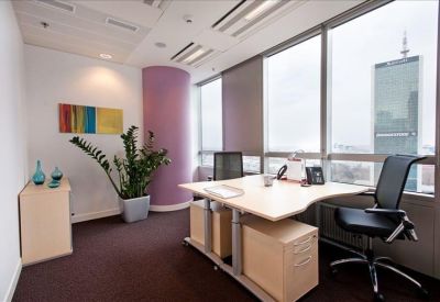 Private office with a purple feature column and panoramic city views.