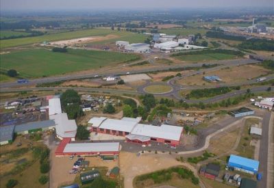 Aerial view of the business park and surrounding green landscape.