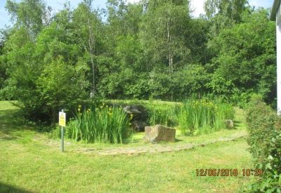 Private office suite with white desks, red task lamps, and framed wall art.