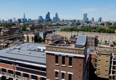 Rooftop terrace overlooking the city skyline with prominent skyscrapers.