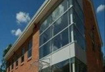 Exterior view of the brick and glass facade at Turnberry Park.