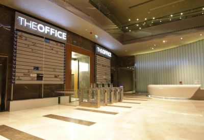 Grand entrance and elevator lobby at Mall Of İstanbul with glass security turnstiles.