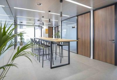 Open communal area with high-top seating and warm wooden finishes.