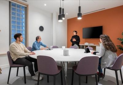 Cozy semi-private workspaces built into wooden alcoves with integrated lighting.