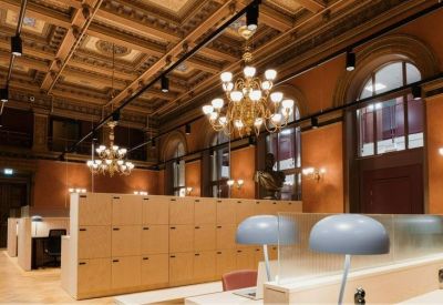 Shared workspace featuring grand chandeliers and ornate coffered ceilings.