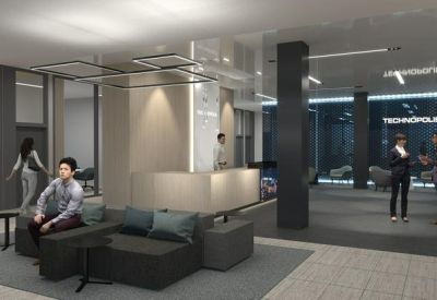 Modern lobby and reception area with a dark grey pillar and built-in desk.