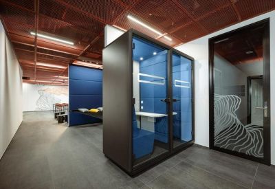 Private acoustic phone booth and a glass door with frosted privacy patterns.