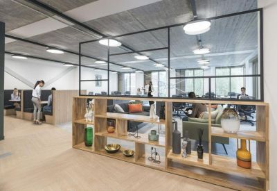 Reception area featuring a wooden display shelf and glass partition wall.