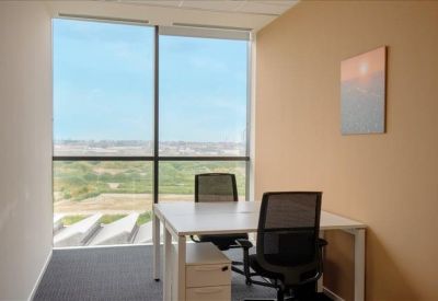 Breakout kitchen area featuring a dark wood breakfast bar and red backsplashes.