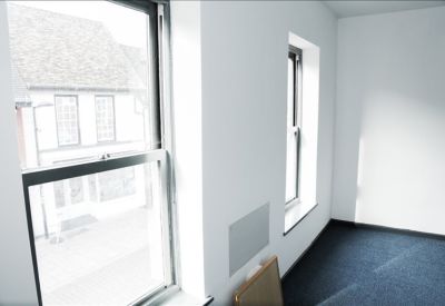 View from an office window overlooking traditional brick buildings.