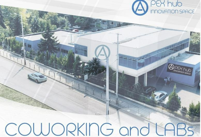 Aerial exterior view of the APEX hub innovation space building and surrounding trees.