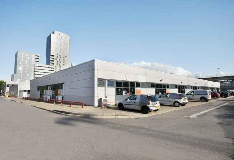 Exterior view of the modern light-colored warehouse units at Poplar Business Park, 10 Prestons Road.