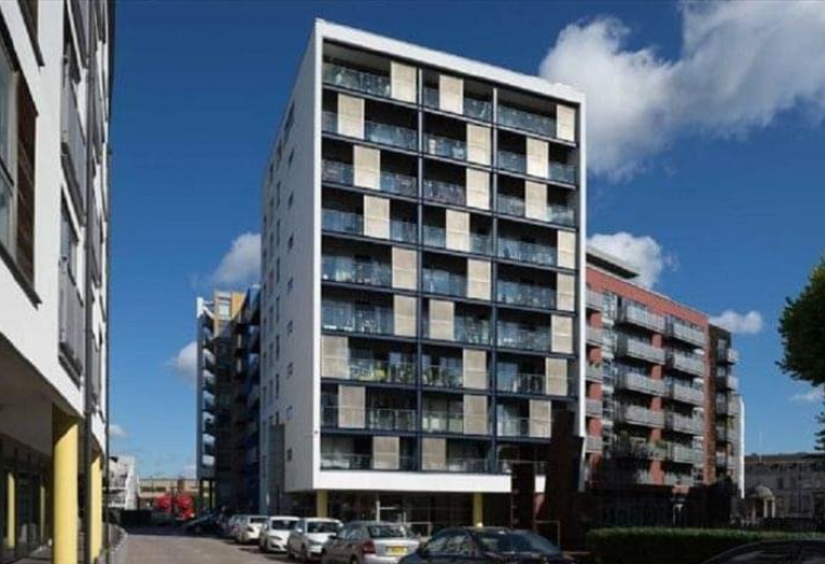 Exterior view of the California Building, a modern apartment and office complex with a checkered facade.