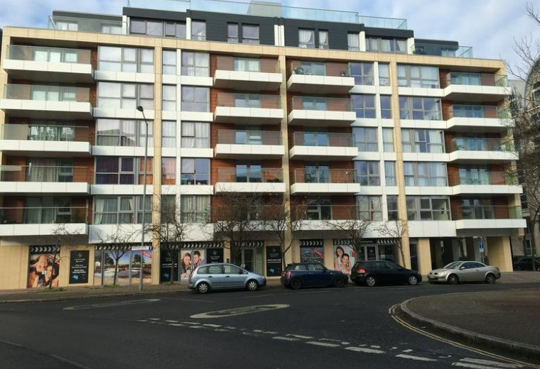 Exterior view of the multi-story modern residential and office building at Tavern Quay, Rope Street.