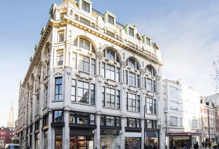 Exterior view of the ornate stone facade at Mappin House on a clear day.