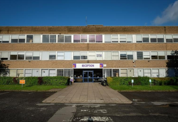 Exterior view of the brick facade and entrance at Moulton Park Business Centre, Northampton.