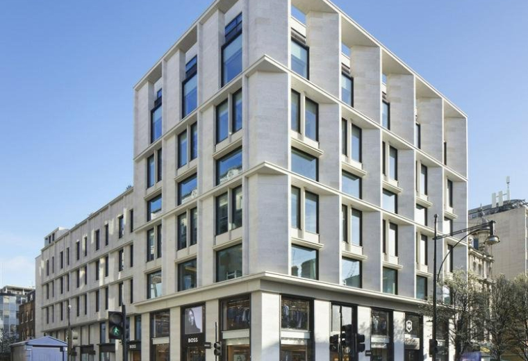 Exterior view of the modern stone and glass facade of the Parcels Building.