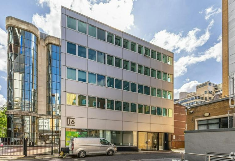 Modern multi-story exterior facade at 16, Saint Clare Street with glass-curved corner and silver cladding.