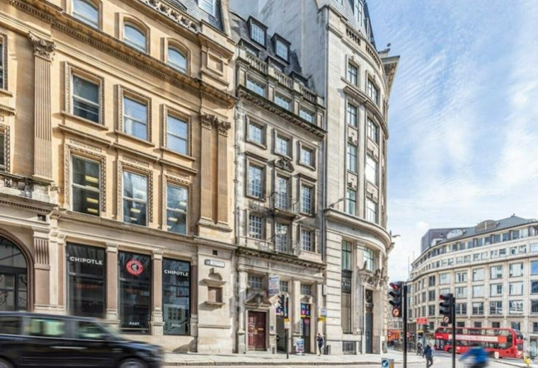 Exterior view of the historic stone facade at 69 King William Street in Monument, London.