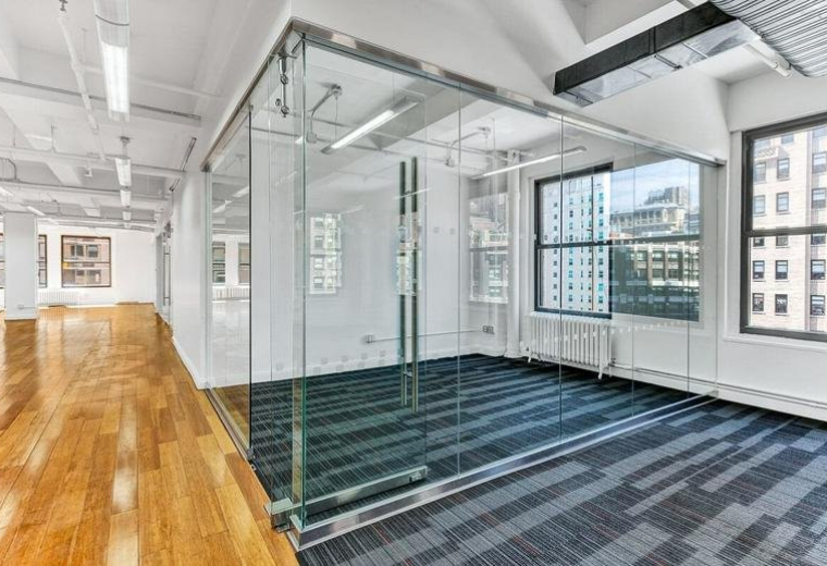 Spacious interior at 5th Floor, 7 Soho Square, Westminster featuring glass-walled offices and wood floors.