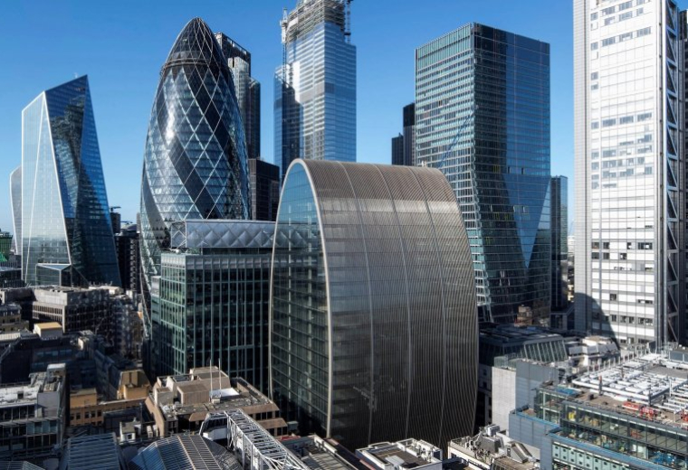 Exterior view of the distinctive glass facade building at 70 St. Mary Axe, London.