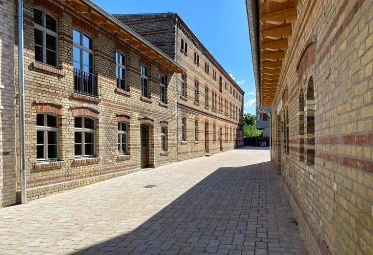 Exterior view of the historic brick industrial buildings at Berliner Strasse 80.
