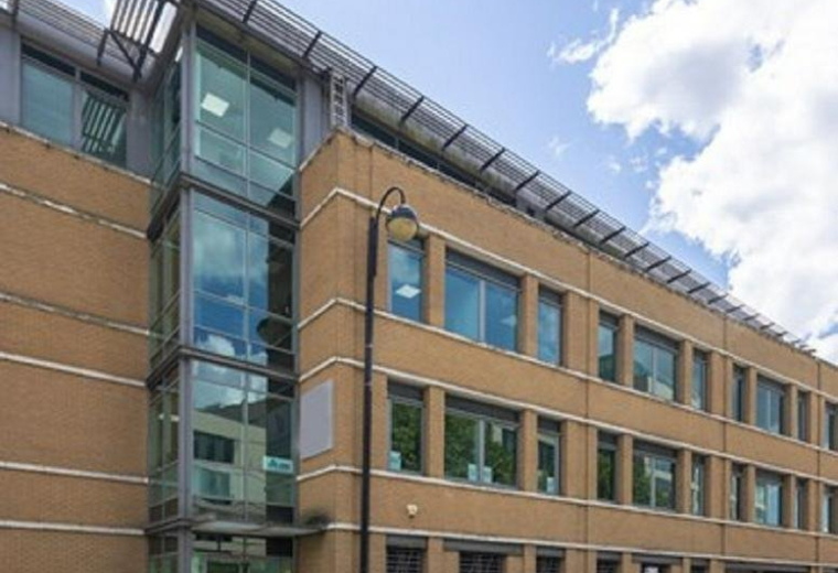 Exterior view of the brick and glass facade of Eagle Court, 9 Vine Road.