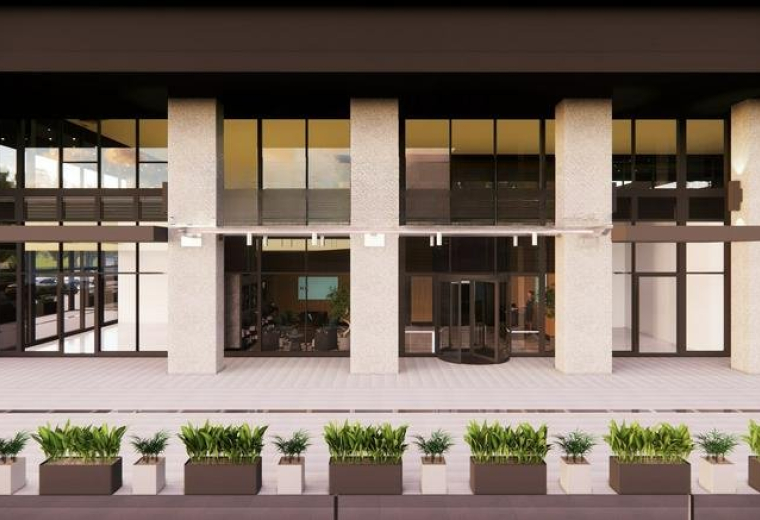 Exterior view of the modern stone and glass facade of Nidya Center, Istanbul.