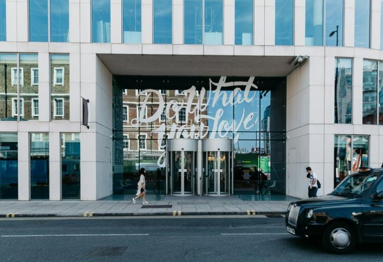Exterior view of the modern glass entrance at 2 Eastbourne Terrace, Paddington.