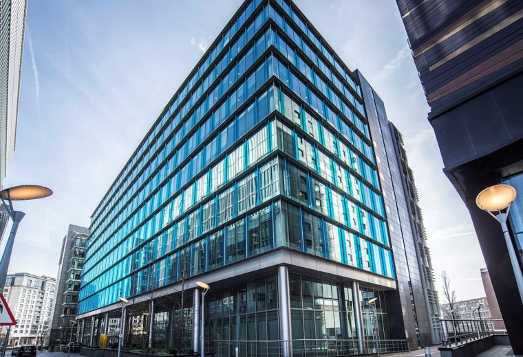 Exterior view of the modern glass-facade building at 2 Kingdom Street in Paddington Central.