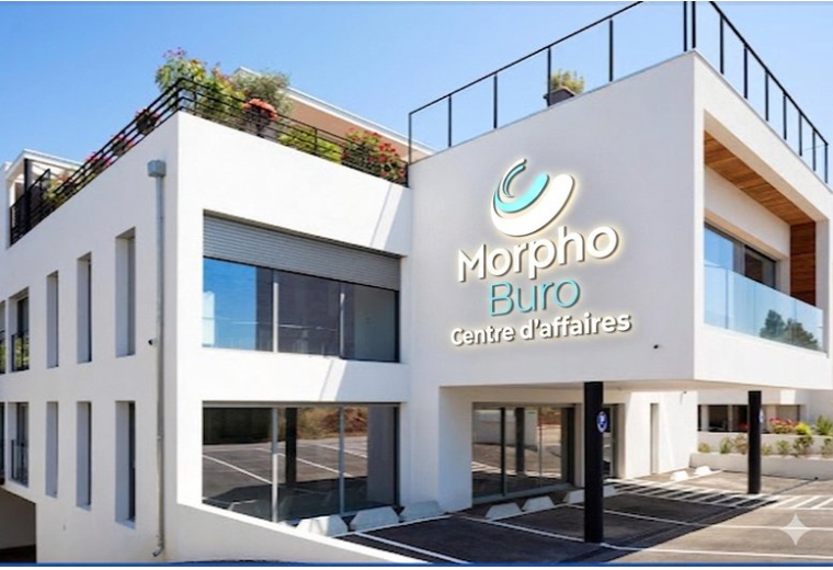 Modern white exterior building facade of 2390, Route des Milles,MORPHOBURO with rooftop greenery.