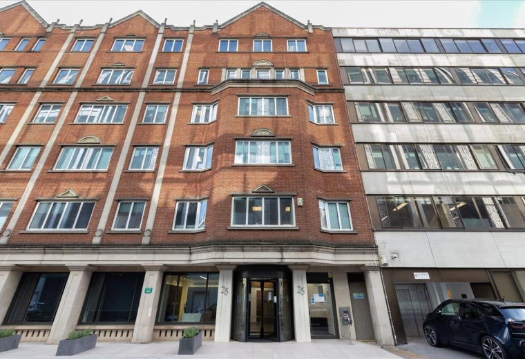 Red brick exterior facade of the 25 North Row building featuring classic architecture.